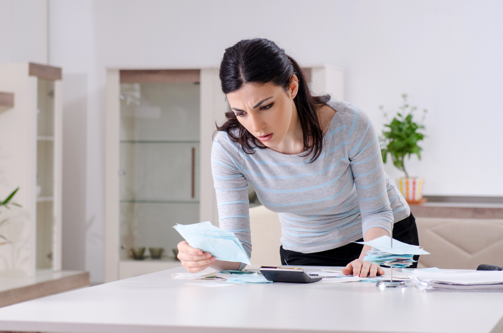 Woman looking over documents during bankruptcy