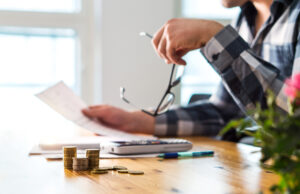 Man looking over financial documents