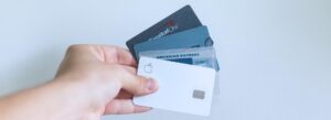 Person holding multiple credit cards