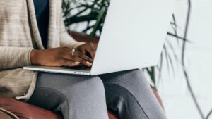 Woman typing on laptop