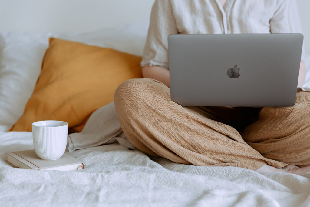 person sitting with laptop